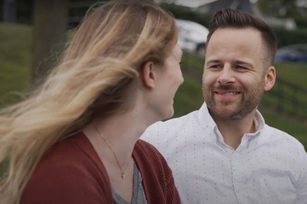 A couple: a woman and man smiling