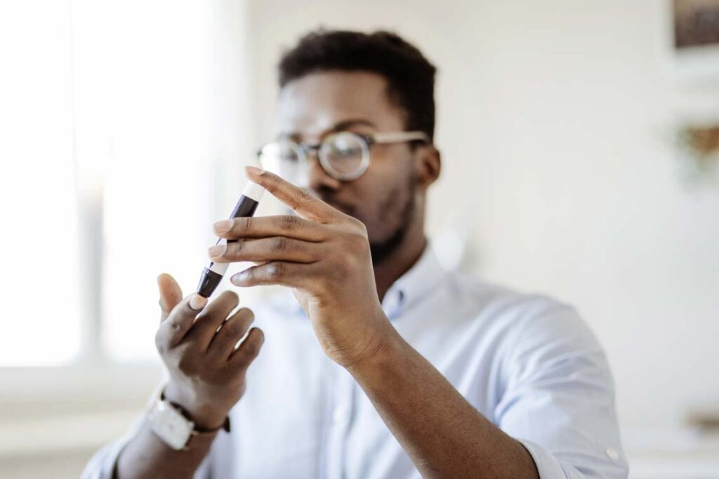 Man testing blood sugar