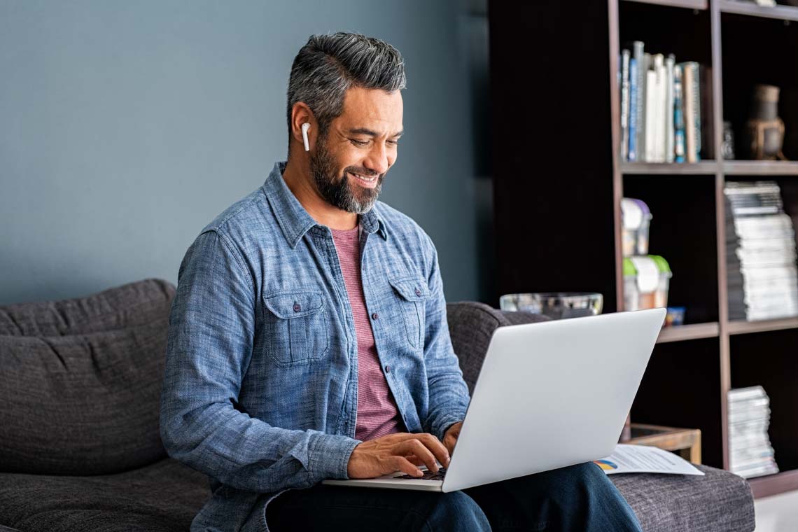 Man taking self-assessment on laptop