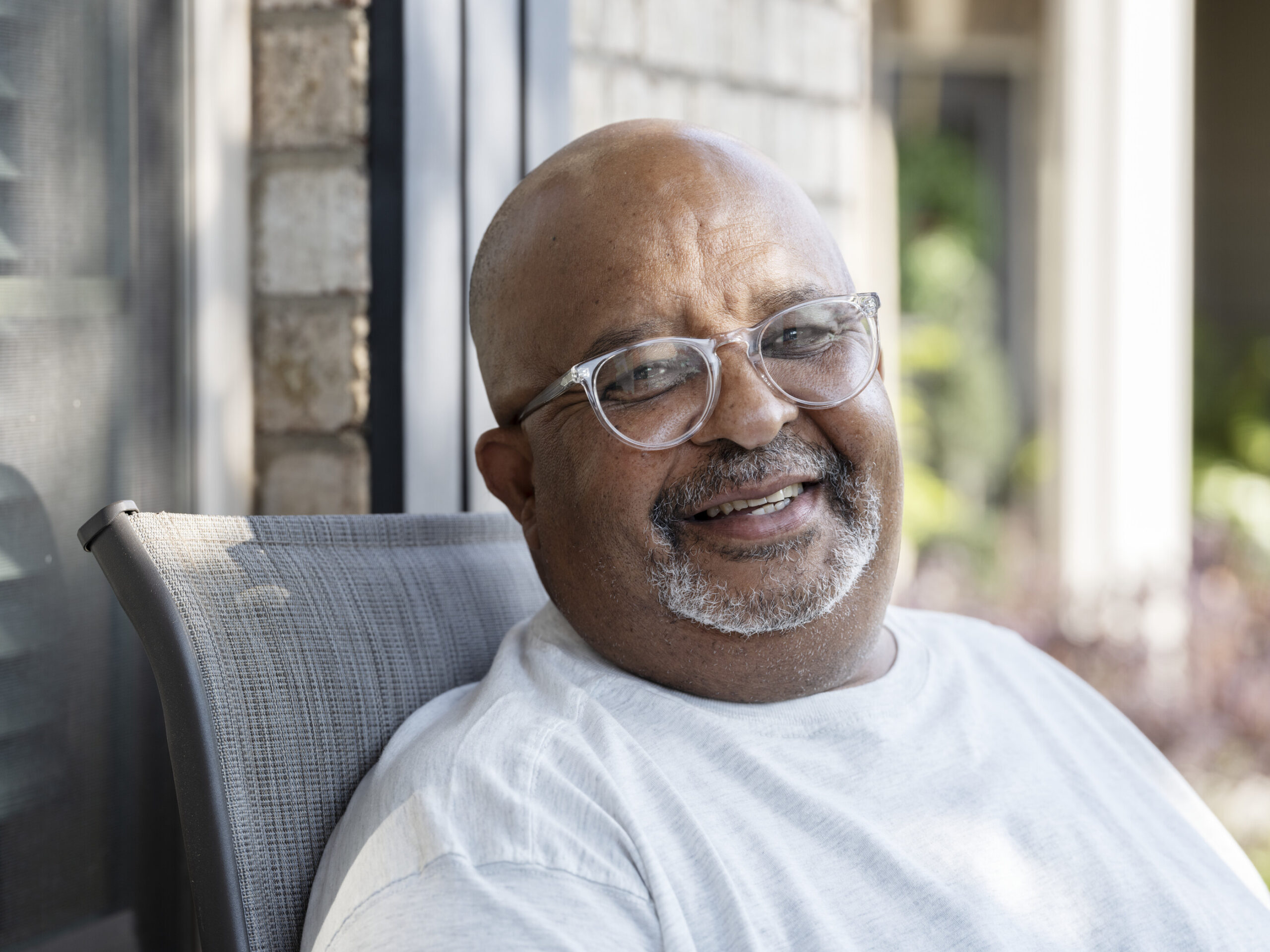 Tony Williams smiling on porch