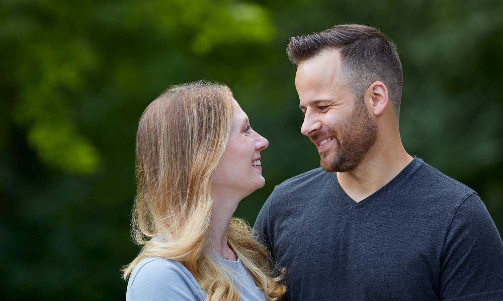 Colin smiling with partner